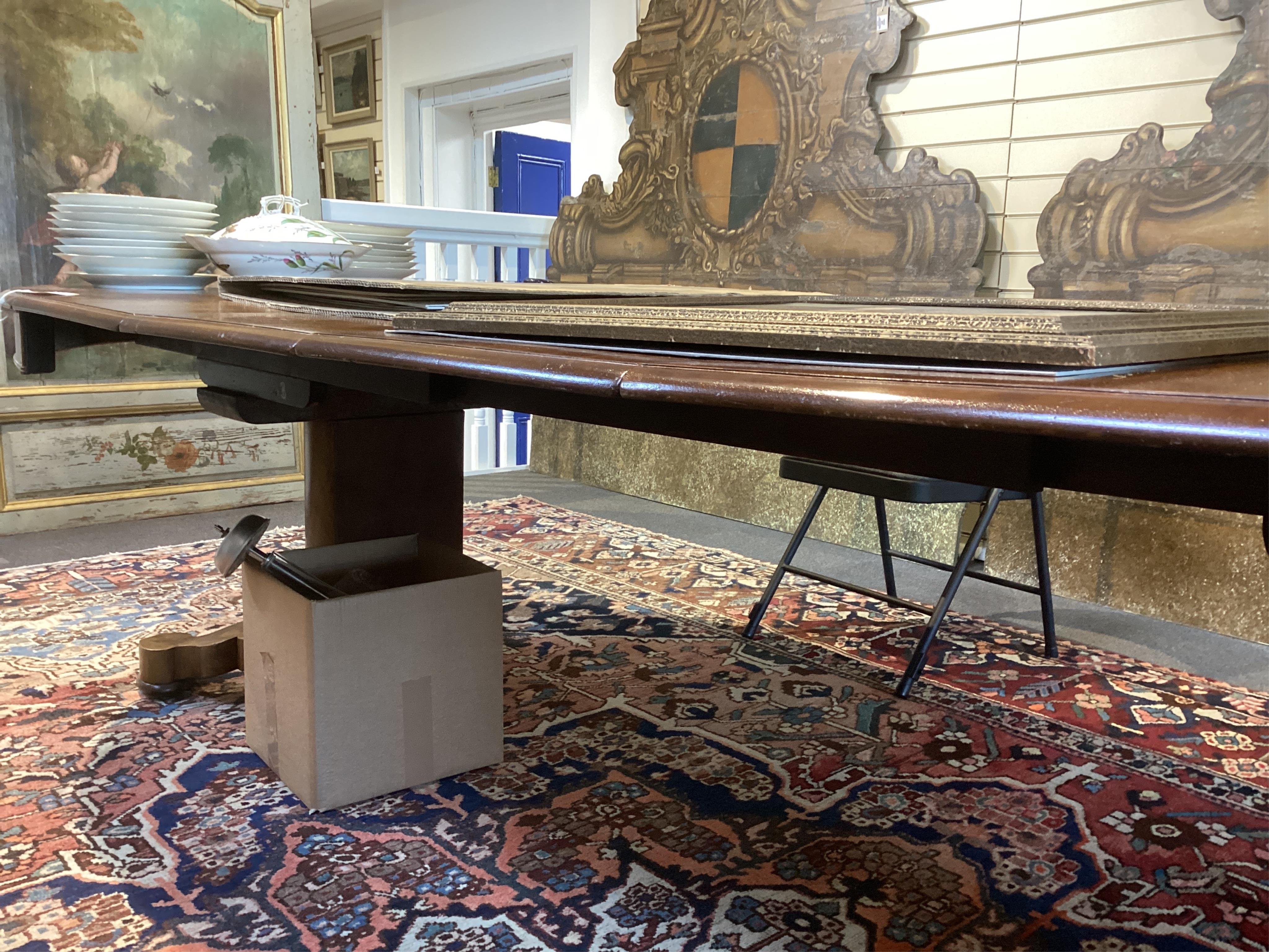 A mid 19th century Continental mahogany extending dining table
